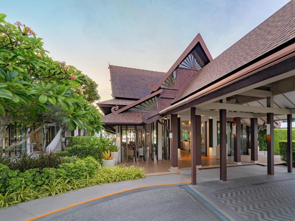 a row of buildings with trees and plants at Amari Koh Samui in Chaweng