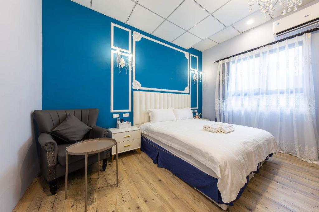 Postel nebo postele na pokoji v ubytování EZ STAY Yancheng