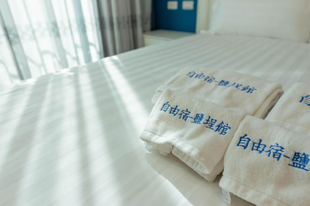 Postel nebo postele na pokoji v ubytování EZ STAY Yancheng