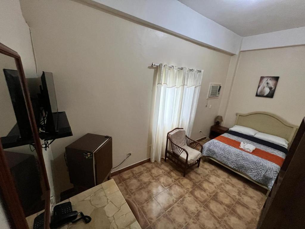 Postel nebo postele na pokoji v ubytování Atlantic Suites Hotel