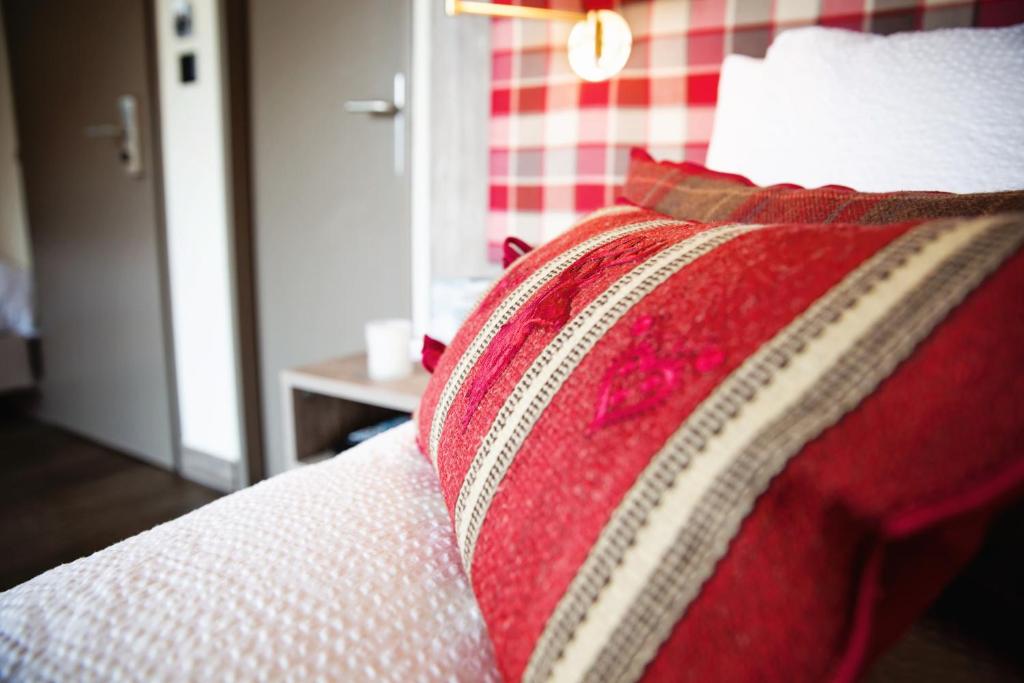 Postel nebo postele na pokoji v ubytování Hotel Bristol Verbier