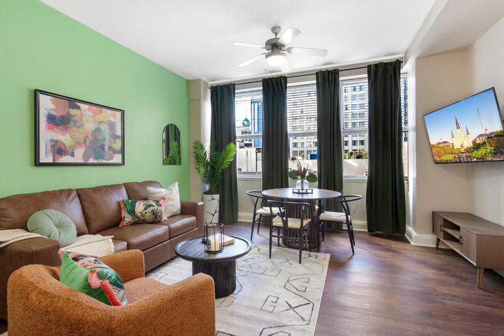 a living room with a couch and a table at Spacious Modern Condos near French Quarter in New Orleans