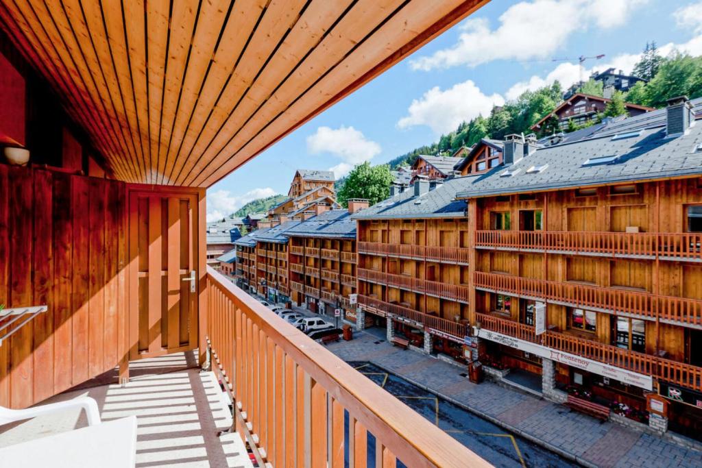 a view from a balcony of a town with buildings at Résidence Les Ravines - maeva Home - Studio 4 Personnes Confort MAE-9397 in Les Allues