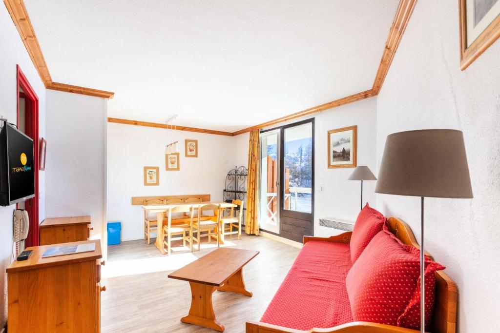 Μια τηλεόραση ή/και κέντρο ψυχαγωγίας στο Résidence Les Bergers - maeva Home - Studio vue montagne + coin cabine 6 personnes - Sélection MAE-0016