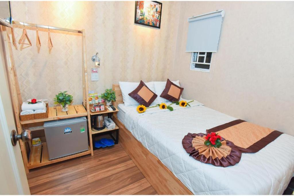 Postel nebo postele na pokoji v ubytování Winny Hotel Ninh Kieu Quay