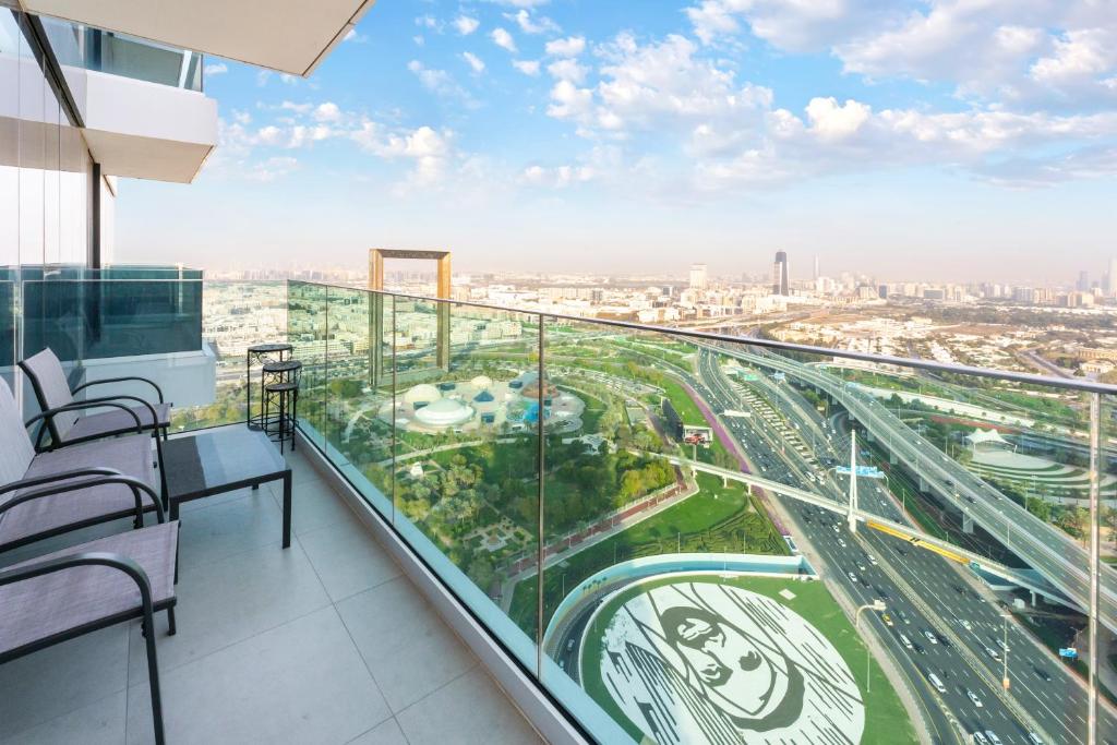 a balcony with a view of a city at FAM Living - 2 Bedroom Home close to Dubai Frame in Dubai