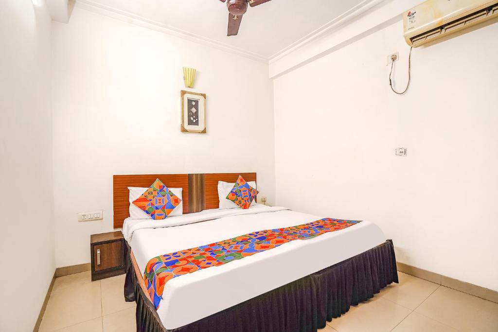 a bedroom with a large bed in a room at FabHotel Sai Residency in Agra