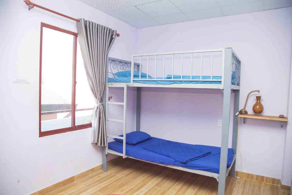 Postel nebo postele na pokoji v ubytování Homestay HoLo