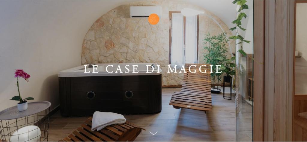 a living room with a table and a dj mixer at Le Case di Maggie in Isolabona