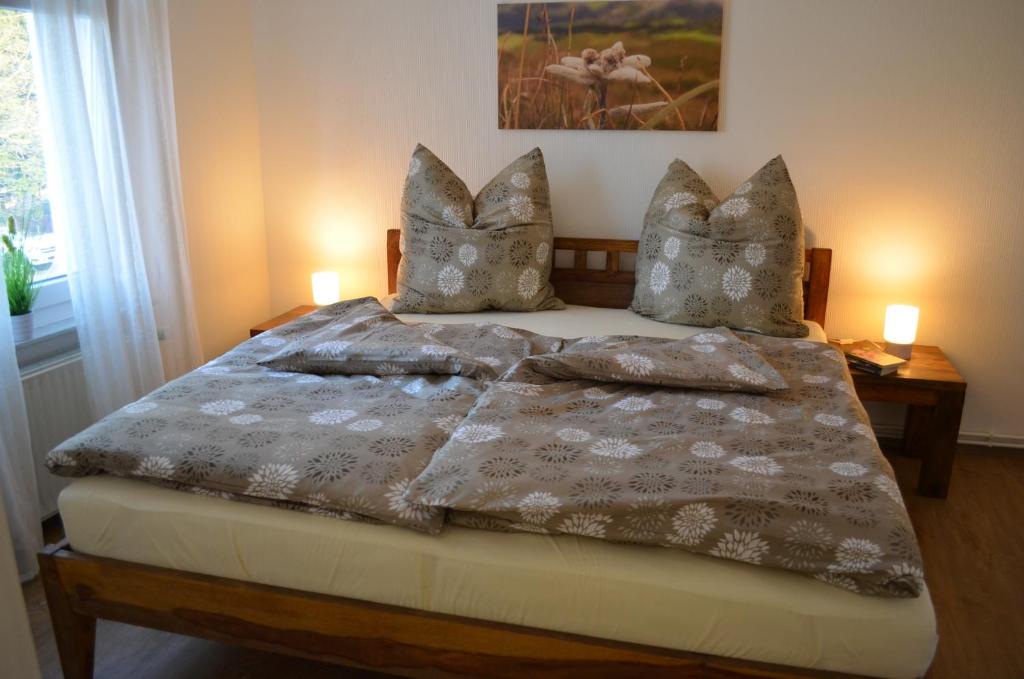 a bedroom with a bed with two pillows on it at Ferienwohnung Edelweiss in Bad Wilsnack