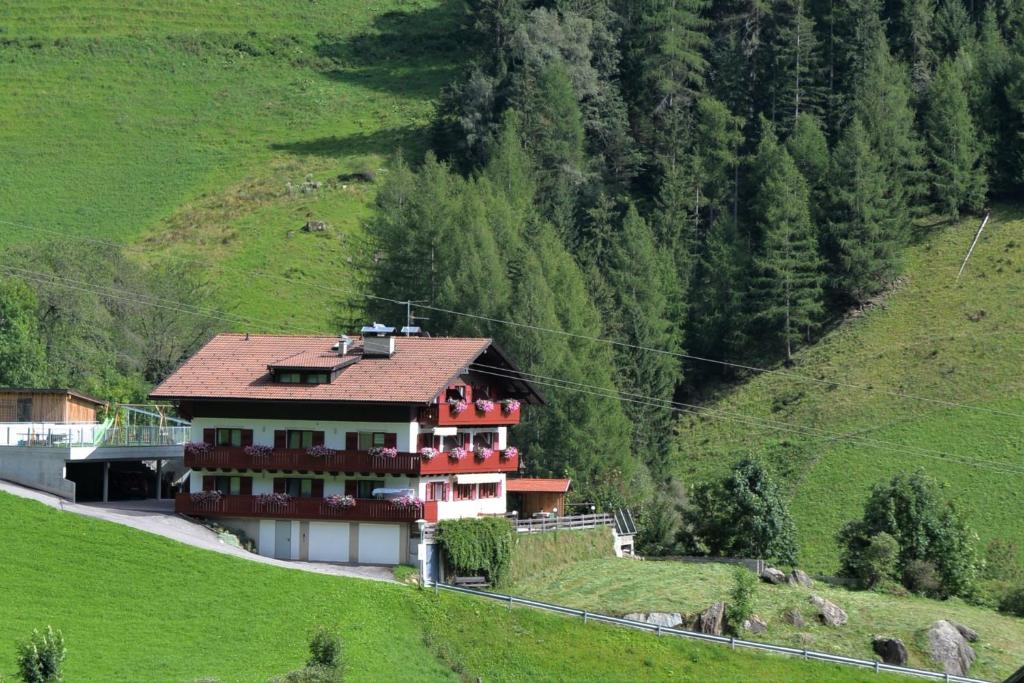 a house on the side of a hill at Garni Waldeck in San Giacomo