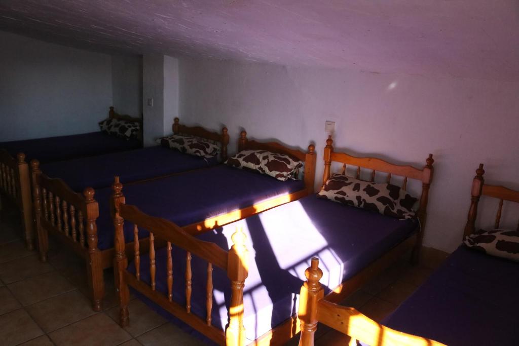 an overhead view of two beds in a room at Casa rural para grupos in Ayora