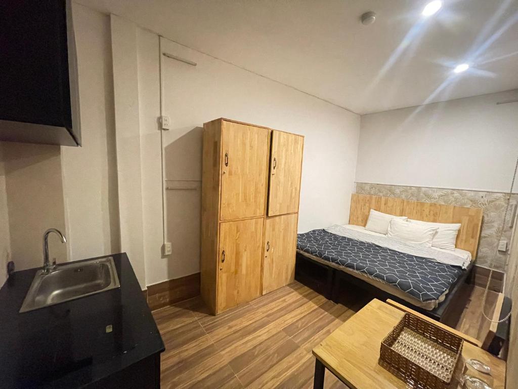 Postel nebo postele na pokoji v ubytování Winny Hotel Ninh Kieu Quay