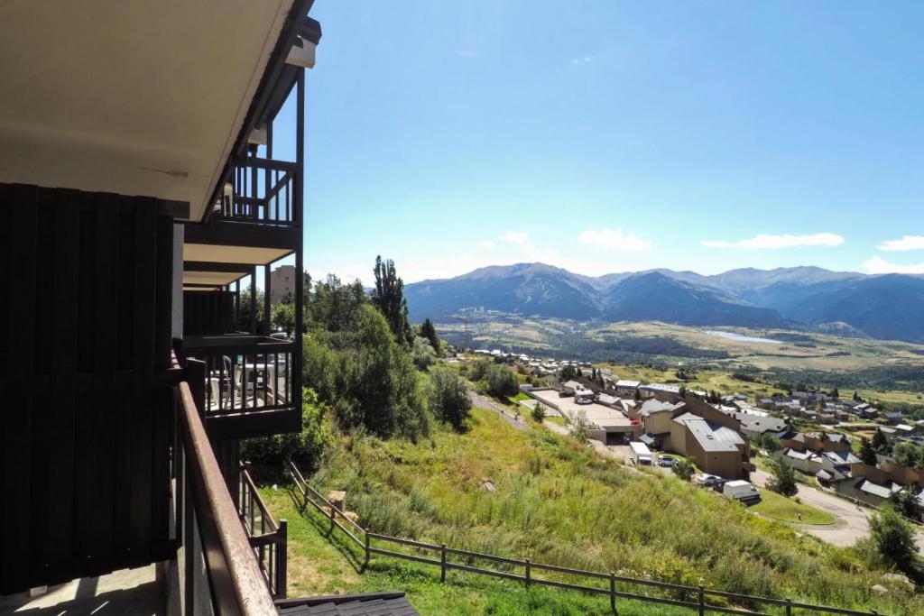 a view of the mountains from the balcony of a house at Résidence Le Pédrou - maeva Home - Studio 2 Personnes - Confort MAE-3956 in Font Romeu Odeillo Via