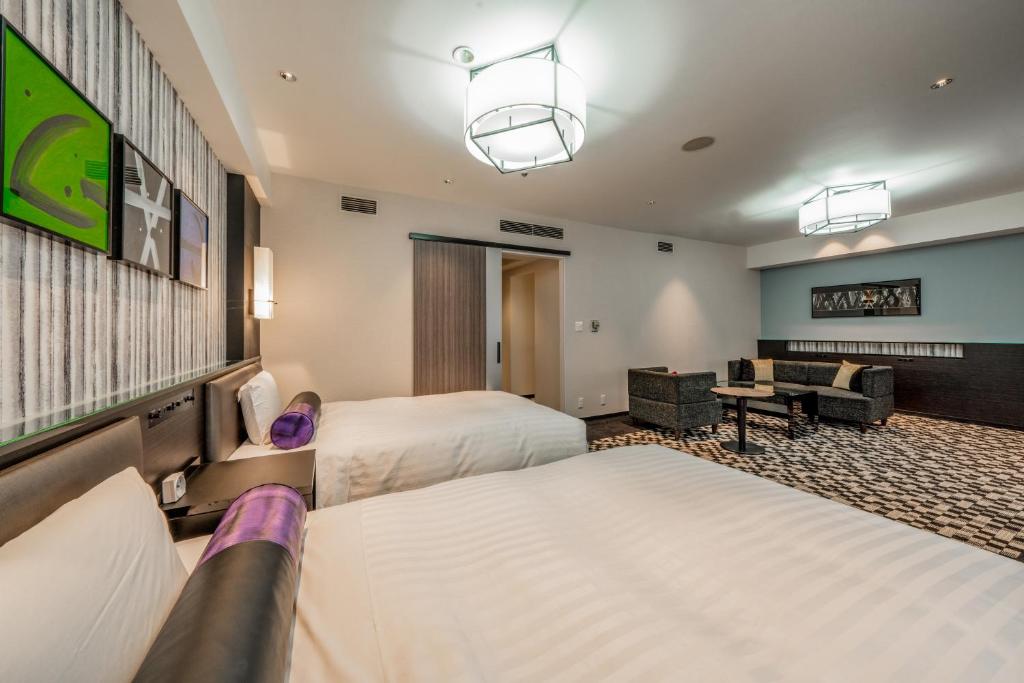 Tempat tidur dalam kamar di New Otani Inn Sapporo