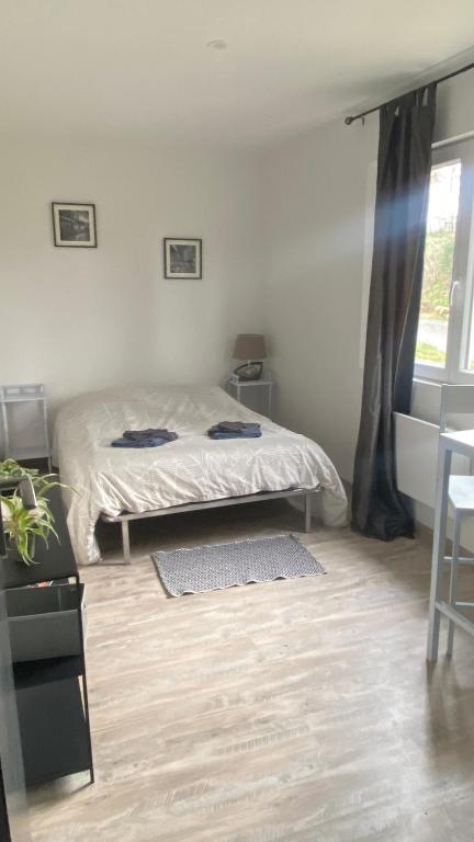 Postel nebo postele na pokoji v ubytování Chambre chez l habitant Audrey