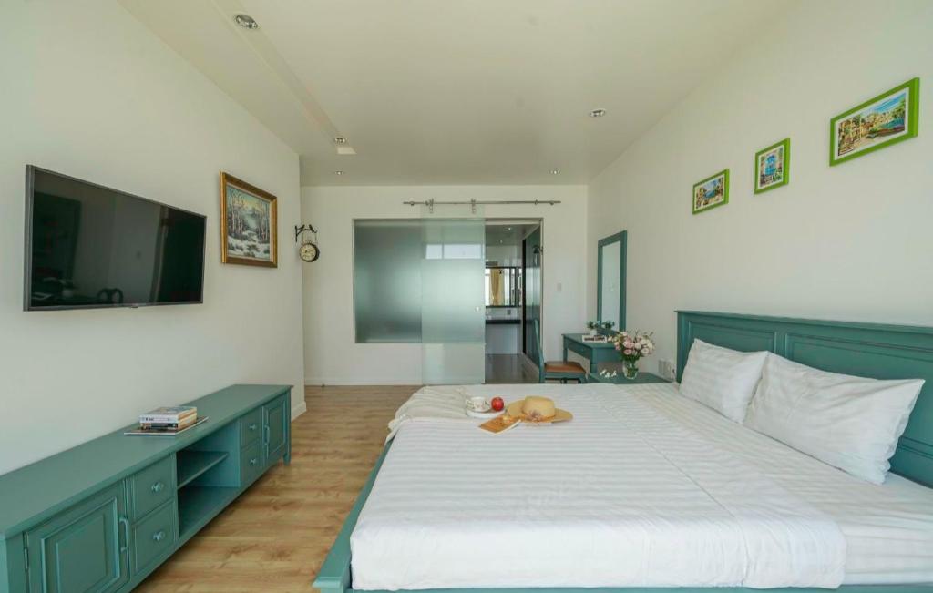 Giường trong phòng chung tại Ocean View Phan Thiết - Ocean Vista &amp; SeaLink Mũi Né