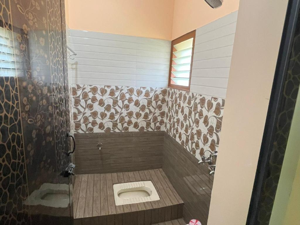 Koupelna v ubytování Sai Ayush Homestay