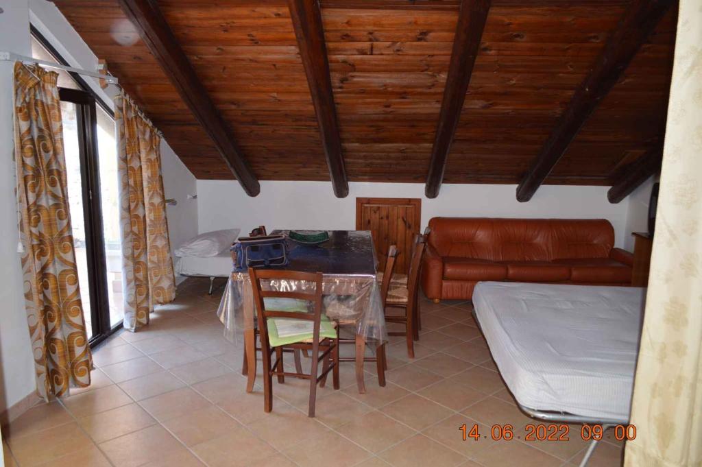 a living room with a table and a couch at Apartment in Ascea - Cilento 38222 in Ascea
