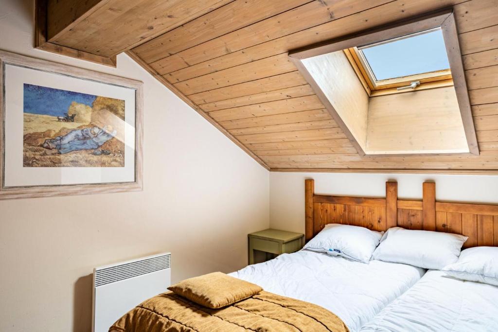 Posteľ alebo postele v izbe v ubytovaní Résidence Les Arcs 1950 Le Village - maeva Home - Appartement 4 pièces 8 personnes - Sélection MAE-4444