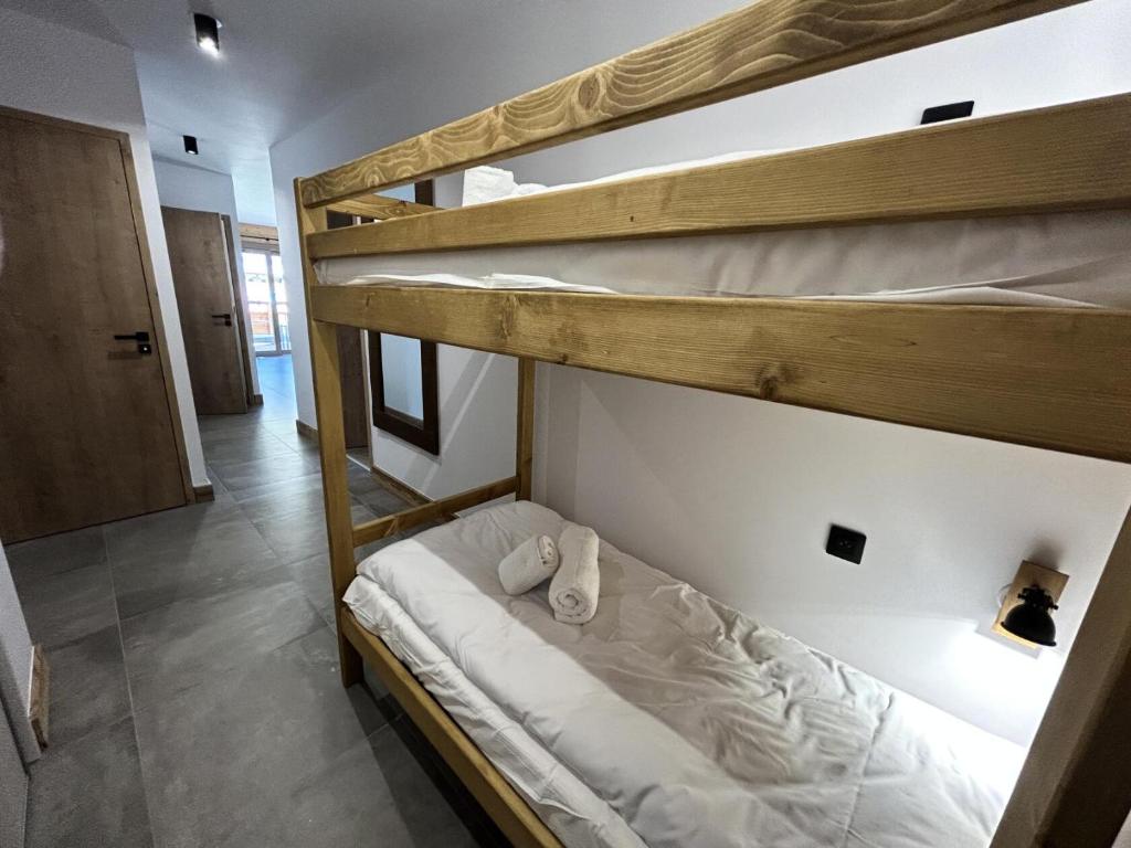 a couple of bunk beds in a room at Résidence LES TERRASSES DE LA VANOISE - Appartement LES TERRASSES DE LA VAN 924 in Champagny-en-Vanoise