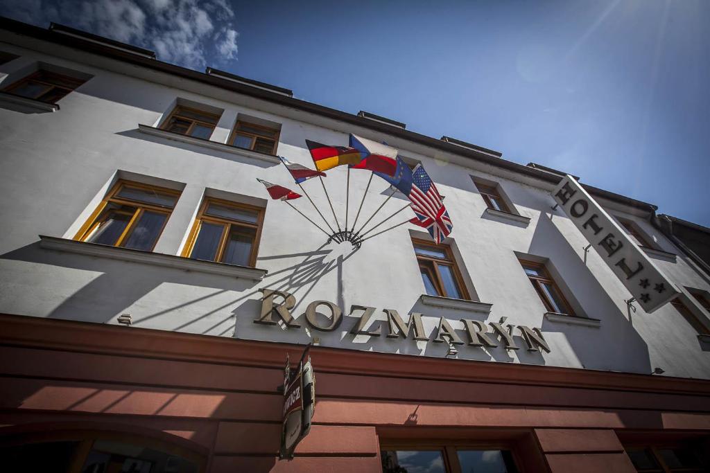 a building with a kite on the side of it at Rozmaryn Hotel B&B in Rakovník