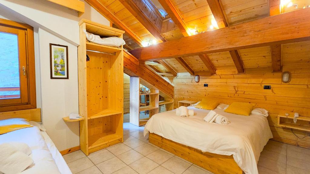 Postel nebo postele na pokoji v ubytování Alps Oriental Wellness HOTEL