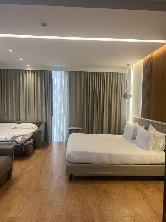 Postel nebo postele na pokoji v ubytování Black Diamond Hotel