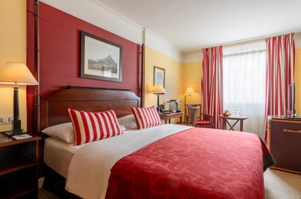 Postel nebo postele na pokoji v ubytování Kipling Manotel