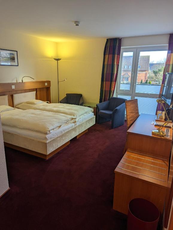 Postel nebo postele na pokoji v ubytování Hotel Flörke