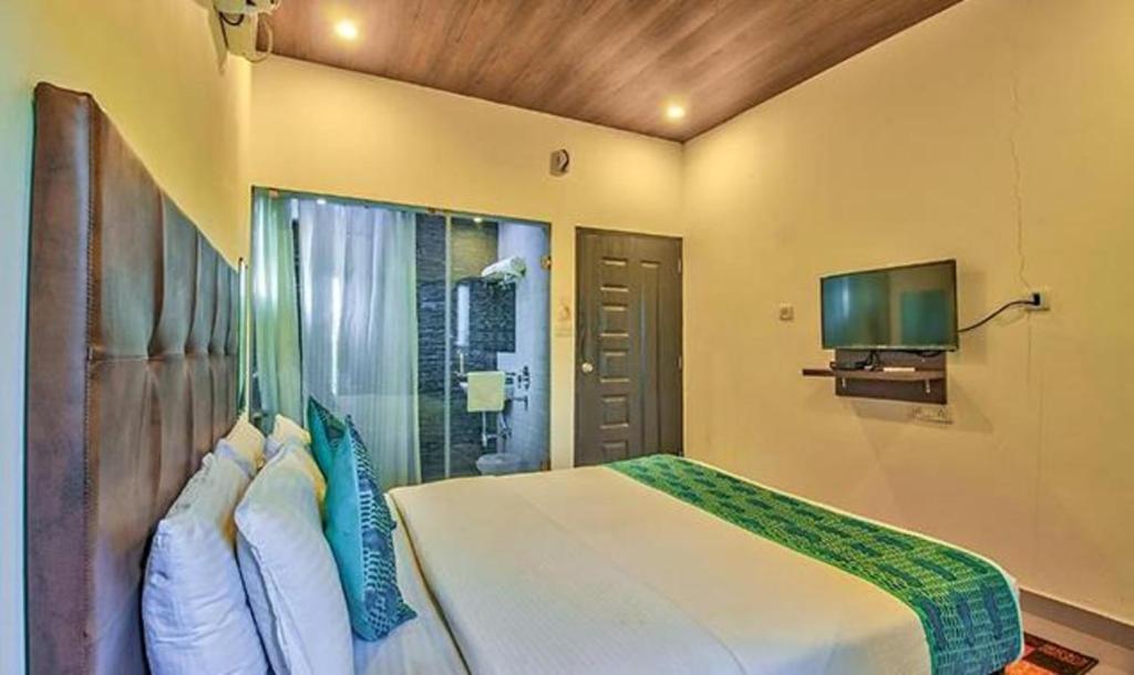 Postel nebo postele na pokoji v ubytování Hotel Balaji Inn Baga