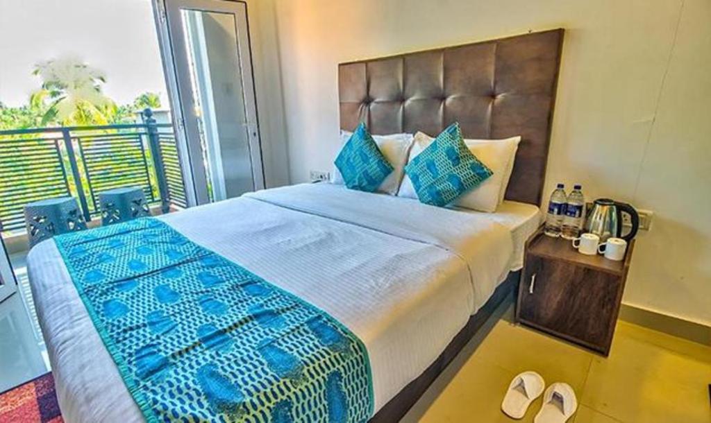 Postel nebo postele na pokoji v ubytování Hotel Balaji Inn Baga