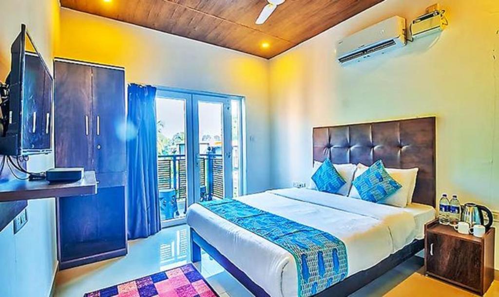 Postel nebo postele na pokoji v ubytování Hotel Balaji Inn Baga