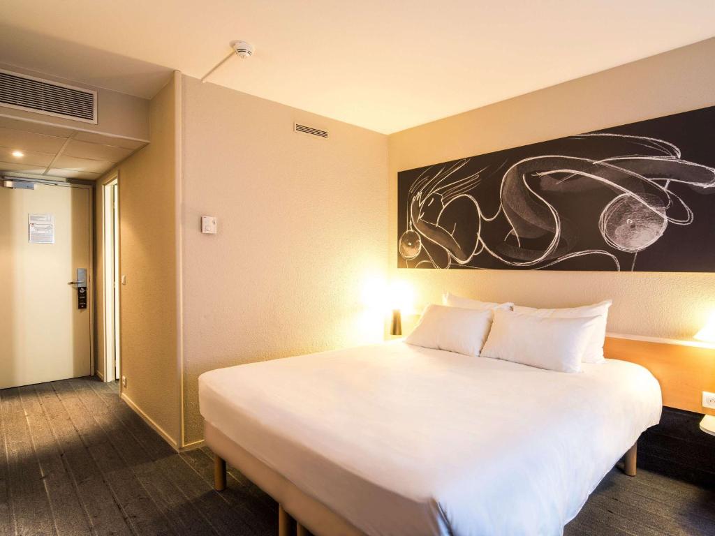 Postel nebo postele na pokoji v ubytování ibis Metz Nord