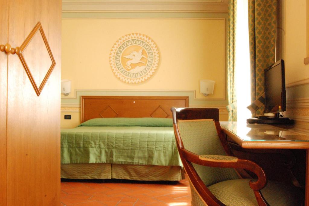 Postel nebo postele na pokoji v ubytování Hotel Diana & Depandance