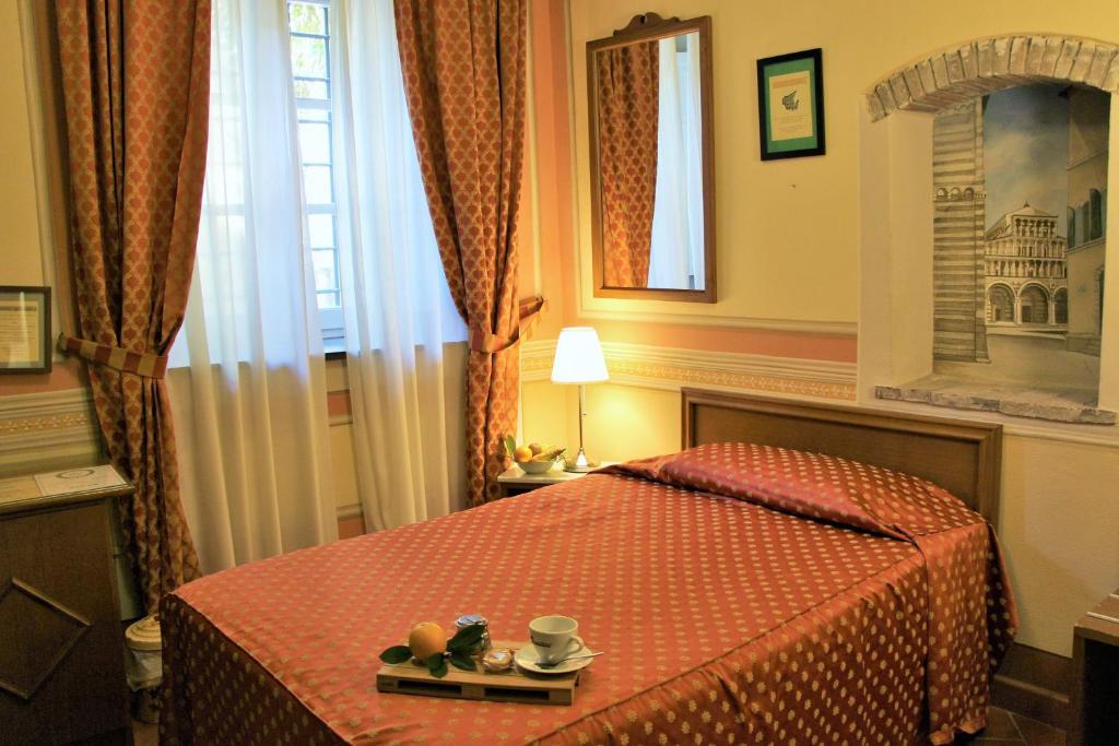 Postel nebo postele na pokoji v ubytování Hotel Diana & Depandance