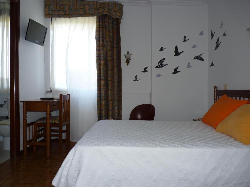 Postel nebo postele na pokoji v ubytování Hotel España