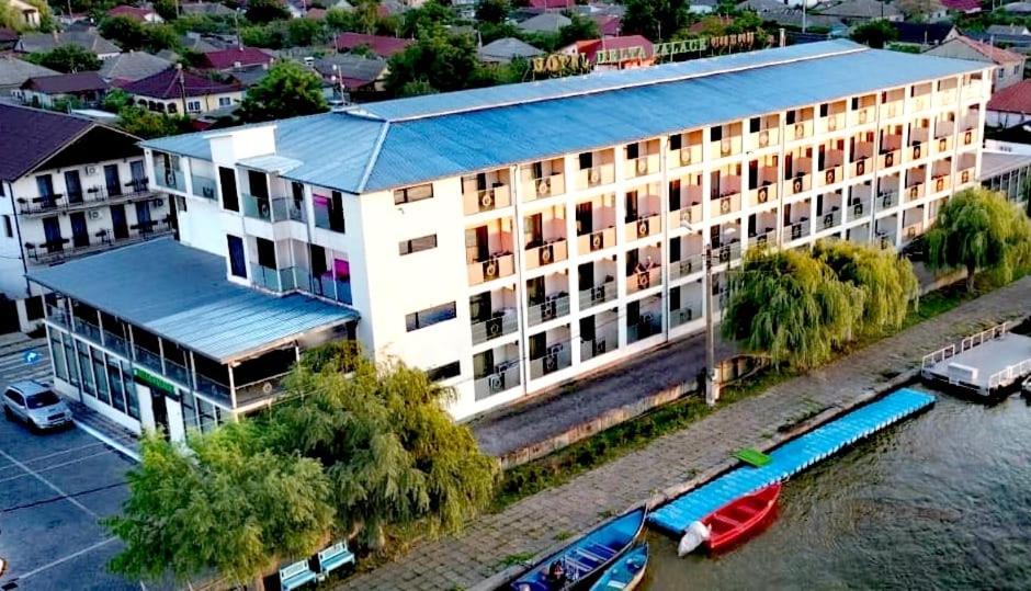 an overhead view of a building next to a river at Delta Palace in Sulina