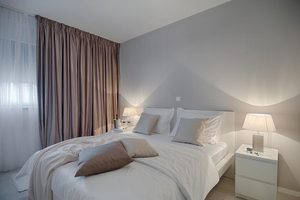 Posteľ alebo postele v izbe v ubytovaní Apartments Deja Views