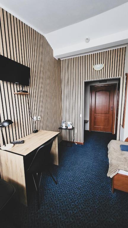 Posteľ alebo postele v izbe v ubytovaní Hotel Na Wzgórzu