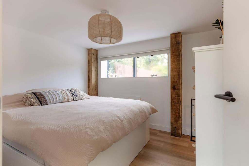 Postel nebo postele na pokoji v ubytování NIEUW! Mooie gezinsvriendelijke villa met ruime tuin!