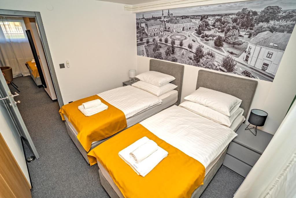 Postel nebo postele na pokoji v ubytování KM therooms BJELOVAR