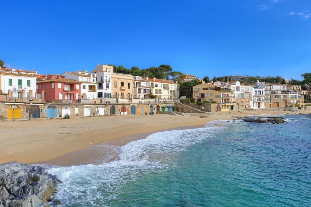 an aerial view of a beach with buildings at CANADELL BLOC B baixos 1ª in Calella de Palafrugell