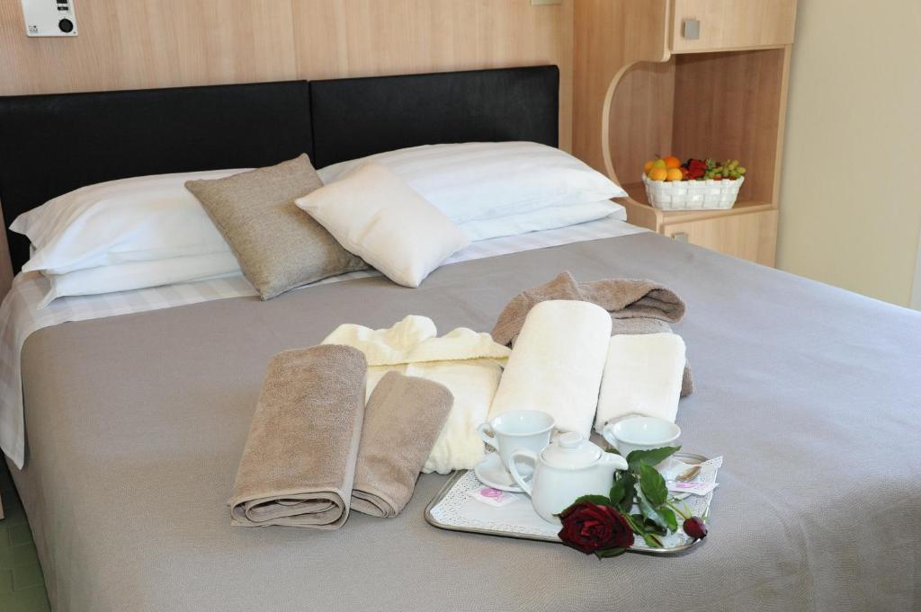 Postel nebo postele na pokoji v ubytování Hotel Lanzoni
