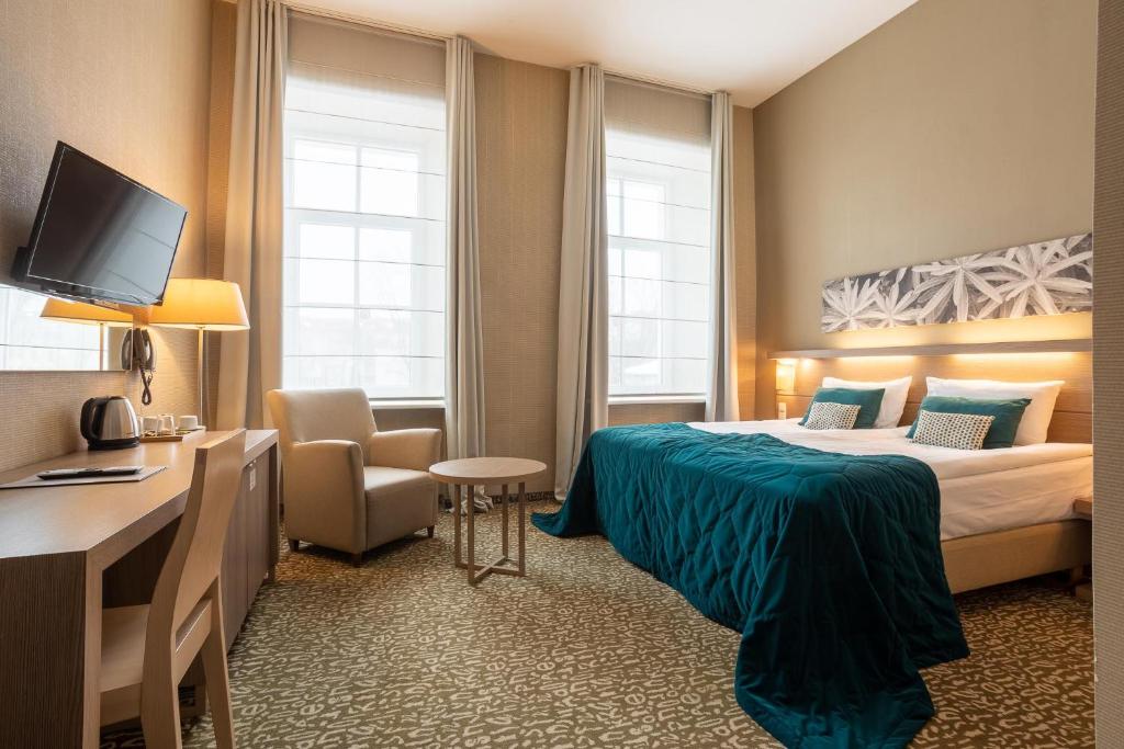 Postel nebo postele na pokoji v ubytování City Hotels Algirdas
