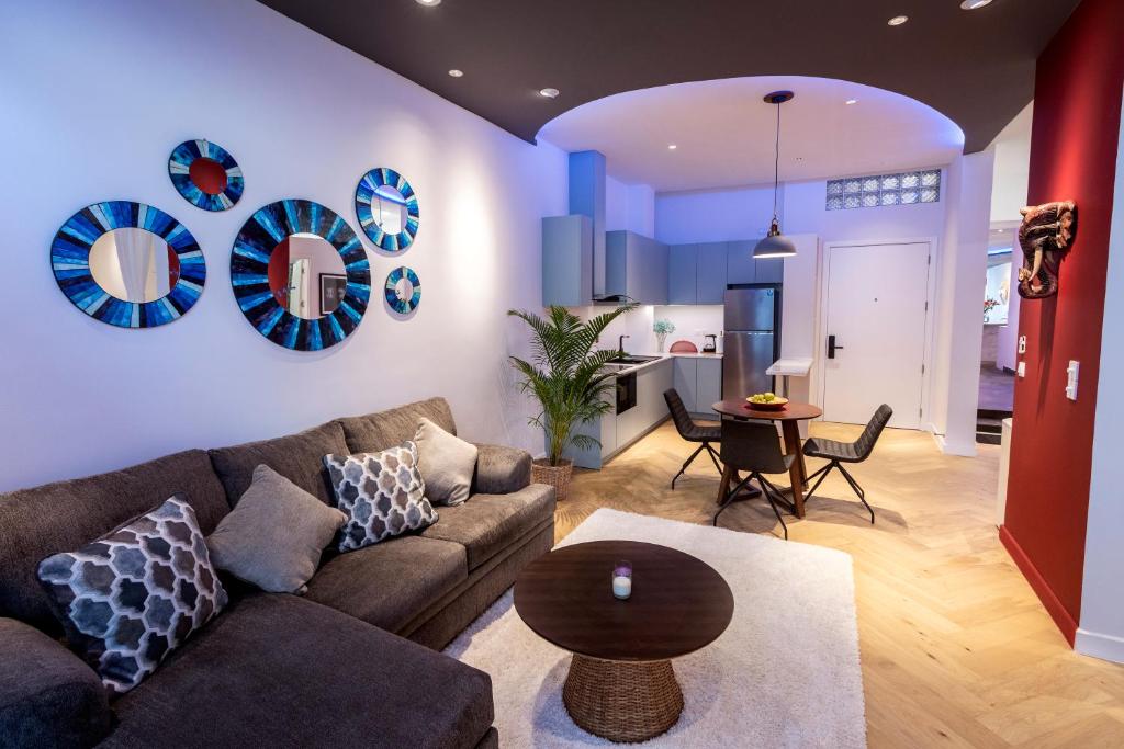 a living room with a couch and a table at Riverside Studio in Phnom Penh