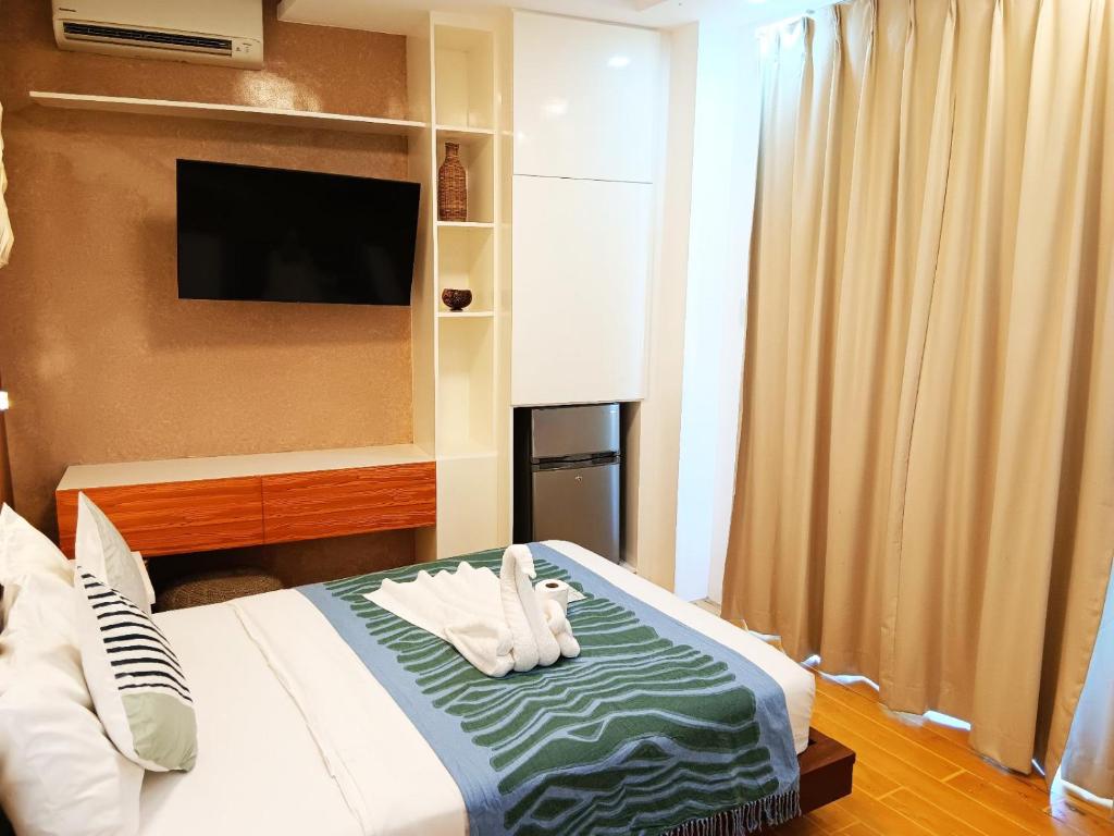 Postel nebo postele na pokoji v ubytování Pipa de Playa Resort Café