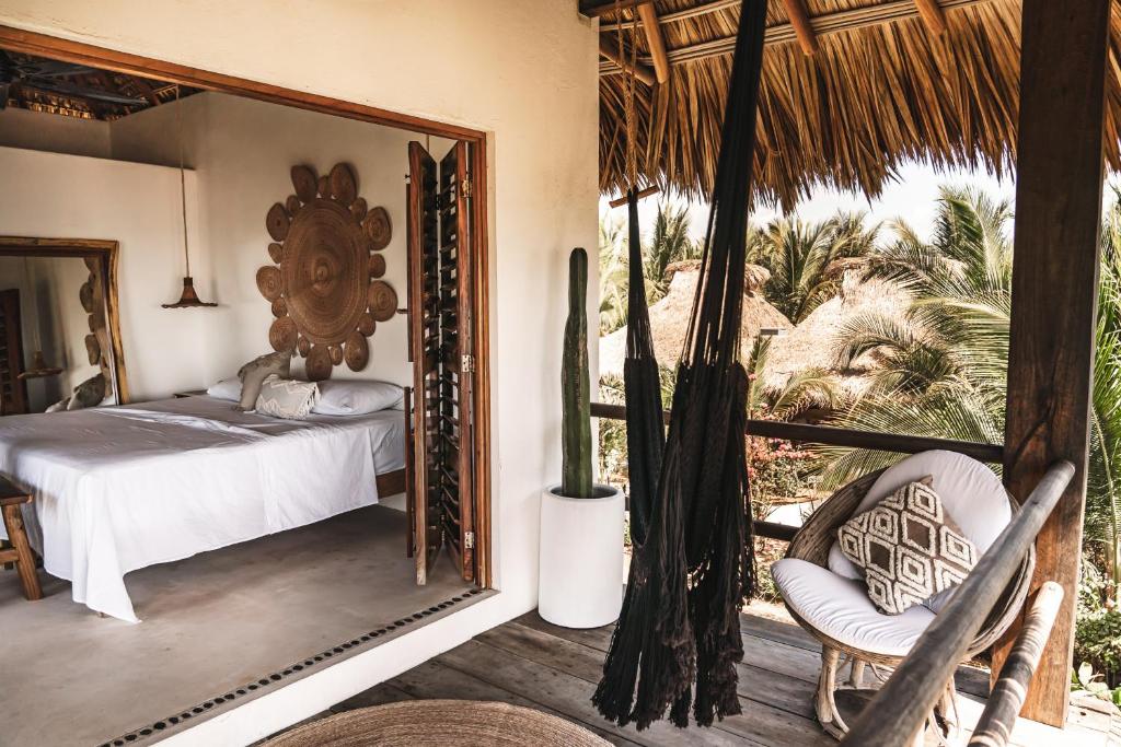 Postel nebo postele na pokoji v ubytování Casa Chula Hotel Boutique Frente al Mar