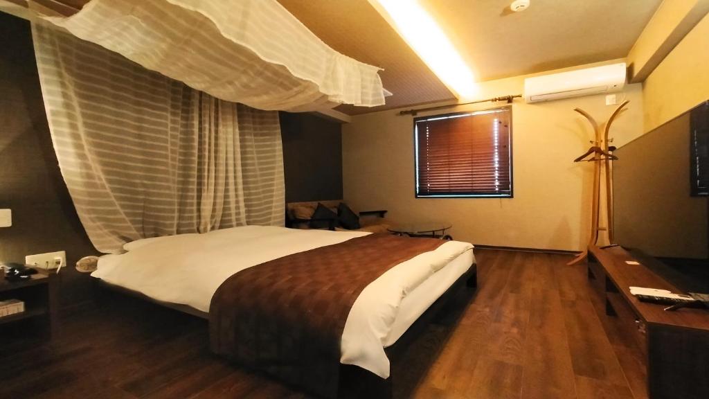 Postel nebo postele na pokoji v ubytování Hotel Wave大人専用