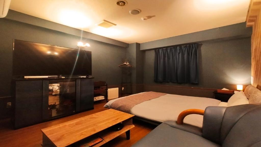 Postel nebo postele na pokoji v ubytování Hotel Wave大人専用